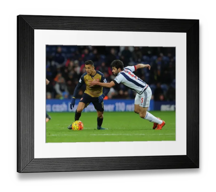 Framed Print : Intense Showdown: Alexis Sanchez vs. Claudio Yacob in West Bromwich Albion vs. Arsenal (Premier League 2015-16)