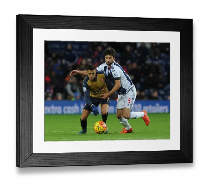 Framed Print : Arsenal's Alexis Sanchez vs. Claudio Yacob: A Fierce Battle in the Premier League Clash between West Brom and Arsenal (November 2015)