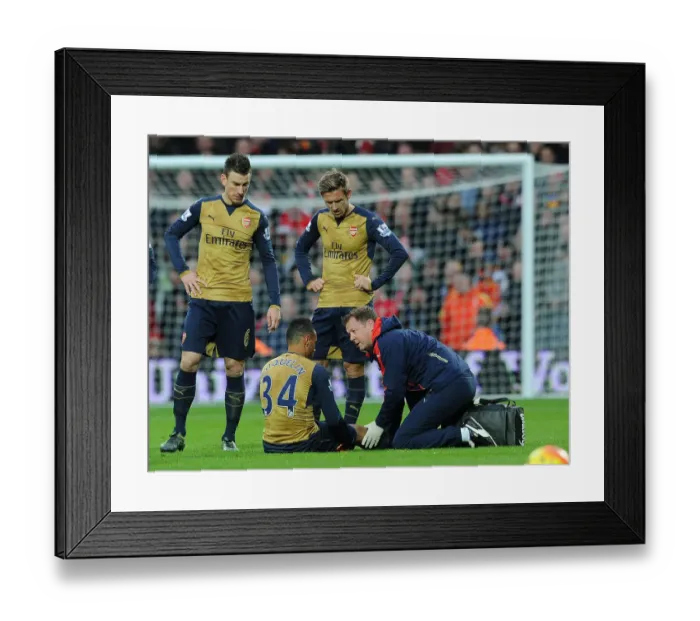 Framed Print : Coquelin Receives Medical Attention During Arsenal's Match against West Bromwich Albion (2015-16)