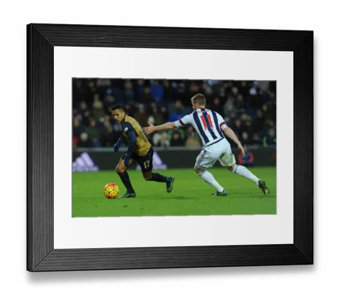 Framed Print : Arsenal's Alexis Sanchez Goes Head-to-Head with Chris Brunt in Premier League Clash: West Bromwich Albion vs. Arsenal (November 2015)