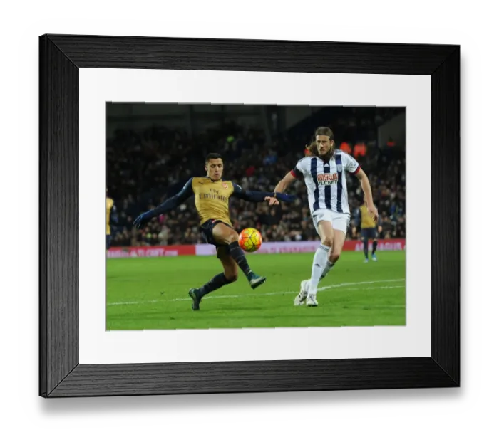 Framed Print : Alexis Sanchez vs. Jonas Olsson: Intense Face-Off in Arsenal's Premier League Battle Against West Brom Framed Print : Alexis Sanchez vs. Jonas Olsson: Intense Face-Off in Arsenal's Premier League Battle Against West Brom