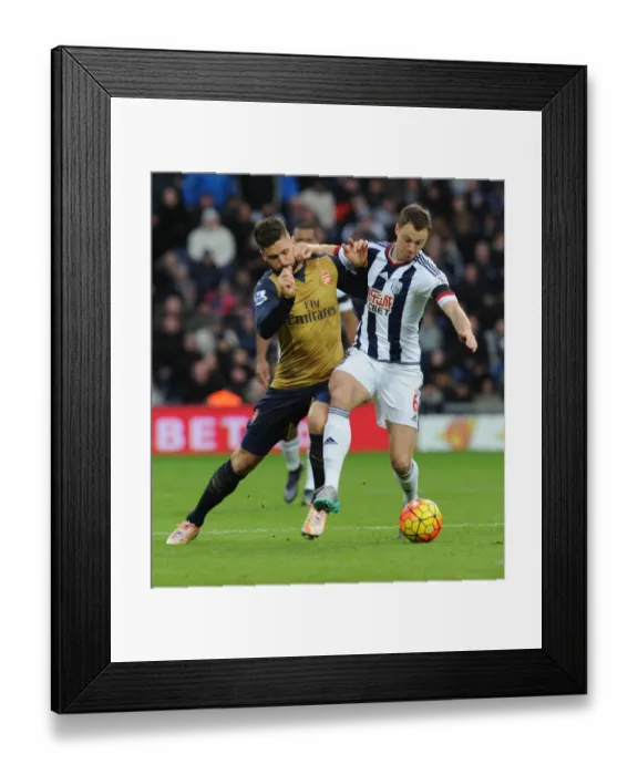 Framed Print : Giroud vs Evans: A Footballing Battle in the Premier League Clash between West Brom and Arsenal Framed Print : Giroud vs Evans: A Footballing Battle in the Premier League Clash between West Brom and Arsenal