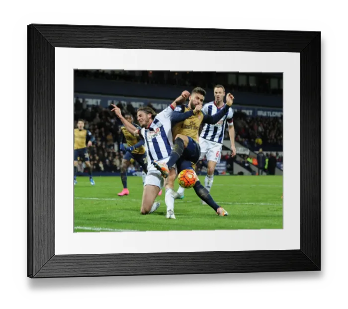 Framed Print : Giroud vs Evans: A Premier League Battle - Intense Tackle Between Arsenal's Star Forward and West Brom's Defender