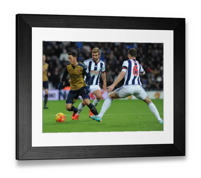 Framed Print : Mesut Ozil vs Jonny Evans: A Football Battle at The Hawthorns - Arsenal vs West Bromwich Albion (2015-16)
