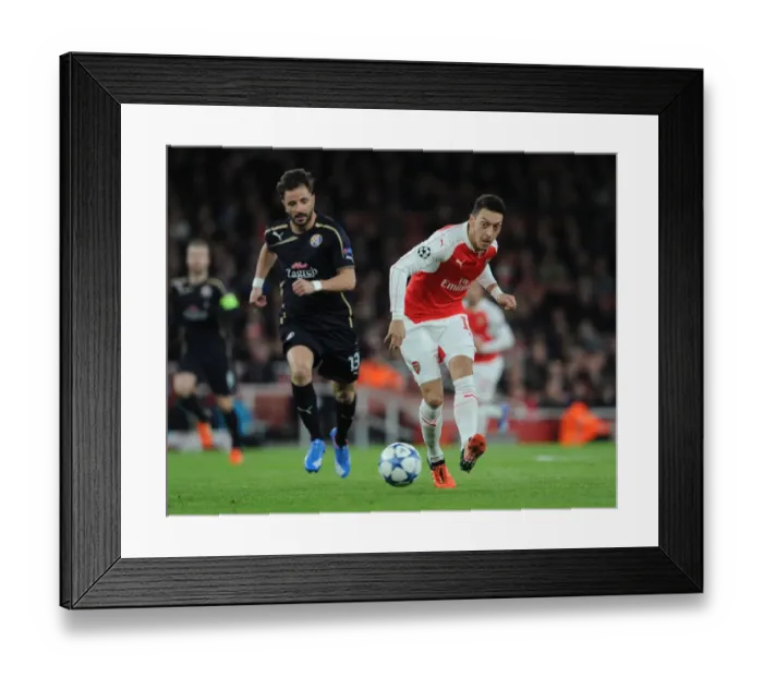 Framed Print : Arsenal's Ozil Dodges Pressure from Dinamo Zagreb's Goncalo Santos in 2015-16 Champions League Showdown Framed Print : Arsenal's Ozil Dodges Pressure from Dinamo Zagreb's Goncalo Santos in 2015-16 Champions League Showdown
