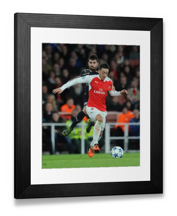 Framed Print : Mesut Ozil Faces Intense Pressure from Paulo Machado in Arsenal's Champions League Clash against Dinamo Zagreb