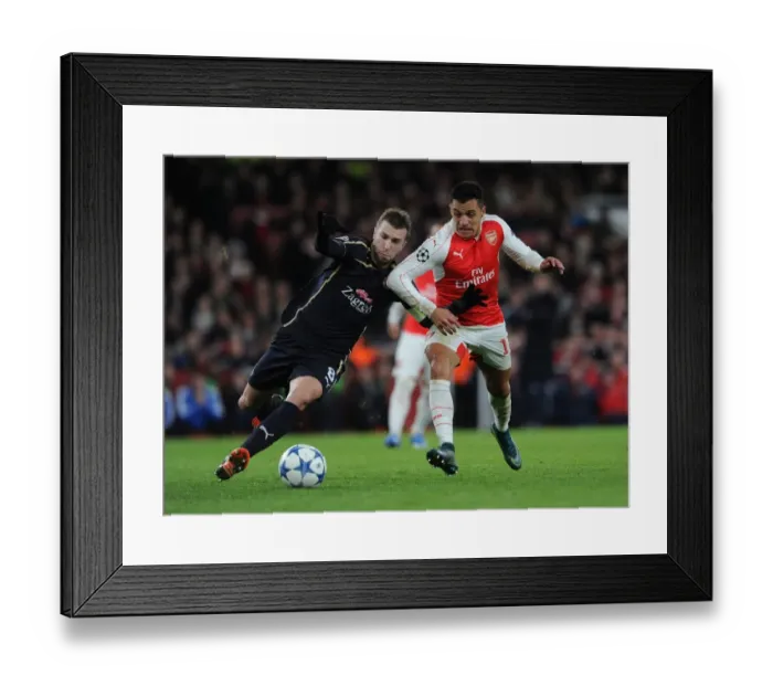 Framed Print : A Battle of Wits: Alexis Sanchez vs. Domagoj Antolic in Arsenal's UEFA Champions League Clash Against Dinamo Zagreb