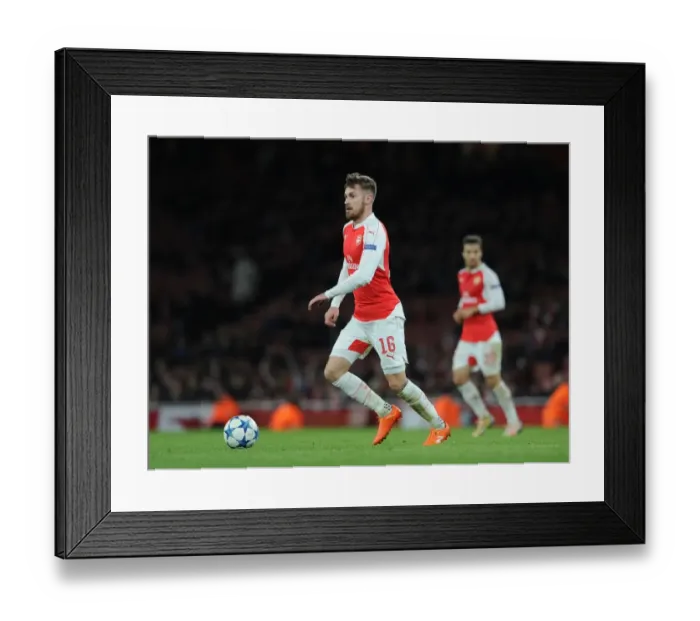 Framed Print : Arsenal's Aaron Ramsey Faces Off Against Dinamo Zagreb in Champions League Clash Framed Print : Arsenal's Aaron Ramsey Faces Off Against Dinamo Zagreb in Champions League Clash