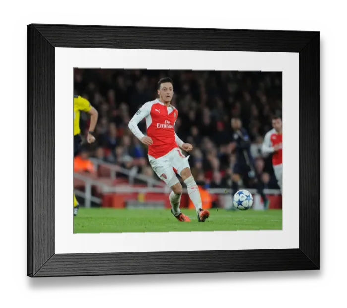 Framed Print : Mesut Ozil's Brilliant Performance: Arsenal Triumphs Over Dinamo Zagreb in Champions League