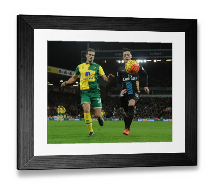 Framed Print : Mesut Ozil Outmaneuvers Ryan Bennett: Premier League Showdown between Norwich and Arsenal (2015-16)