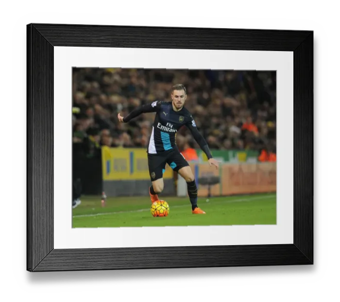 Framed Print : Aaron Ramsey (Arsenal). Norwich City 1: 1 Arsenal. Barclays Premier League. Carrow Road Framed Print : Aaron Ramsey (Arsenal). Norwich City 1: 1 Arsenal. Barclays Premier League. Carrow Road