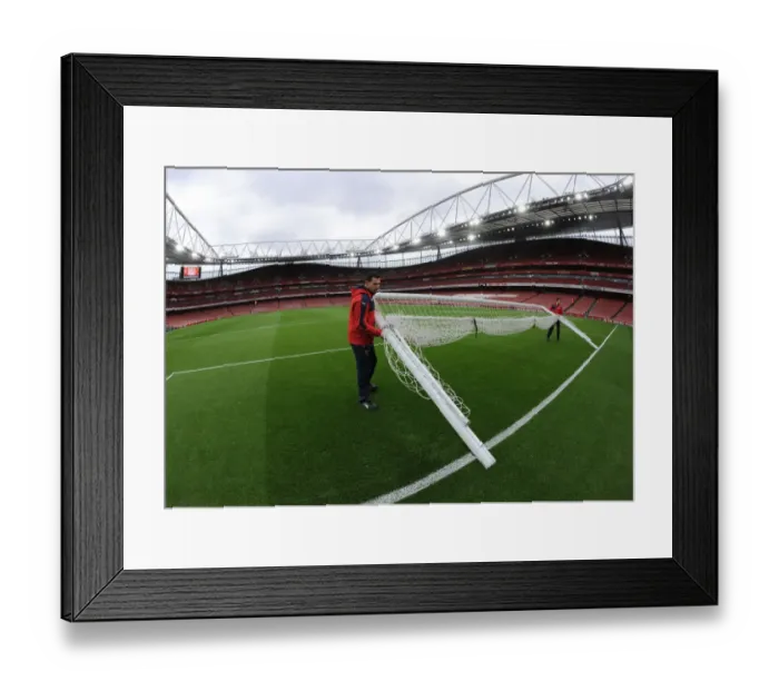 Framed Print : Arsenal Readies the Field: Groundsman Sets Up Goals for Sunderland Showdown