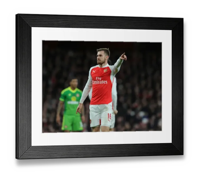 Framed Print : Arsenal's Aaron Ramsey Battles for Possession Against Sunderland in Premier League Showdown