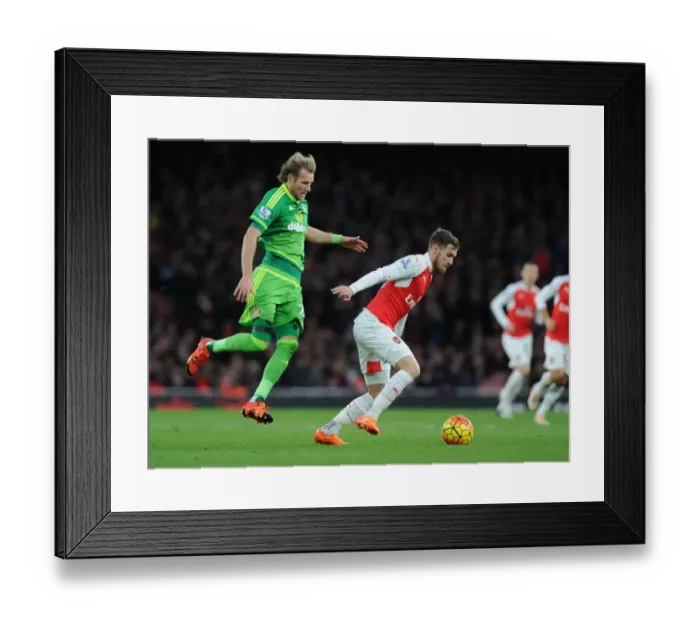Framed Print : Ramsey's Agile Moves: Outmaneuvering Toivonen in Arsenal's Premier League Victory Framed Print : Ramsey's Agile Moves: Outmaneuvering Toivonen in Arsenal's Premier League Victory