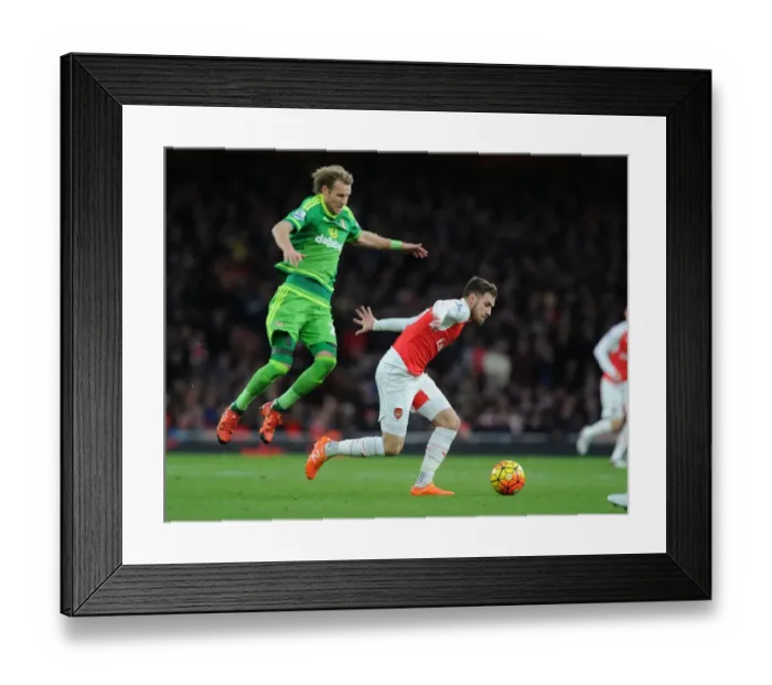 Framed Print : Arsenal's Ramsey Outshines Toivonen: Agile Moves in Arsenal's Victory over Sunderland (2015-16) Framed Print : Arsenal's Ramsey Outshines Toivonen: Agile Moves in Arsenal's Victory over Sunderland (2015-16)