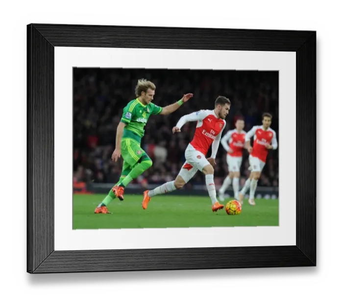 Framed Print : Ramsey Dashes Past Toivonen: Arsenal's Thrilling Victory Over Sunderland (2015-16 Premier League) Framed Print : Ramsey Dashes Past Toivonen: Arsenal's Thrilling Victory Over Sunderland (2015-16 Premier League)