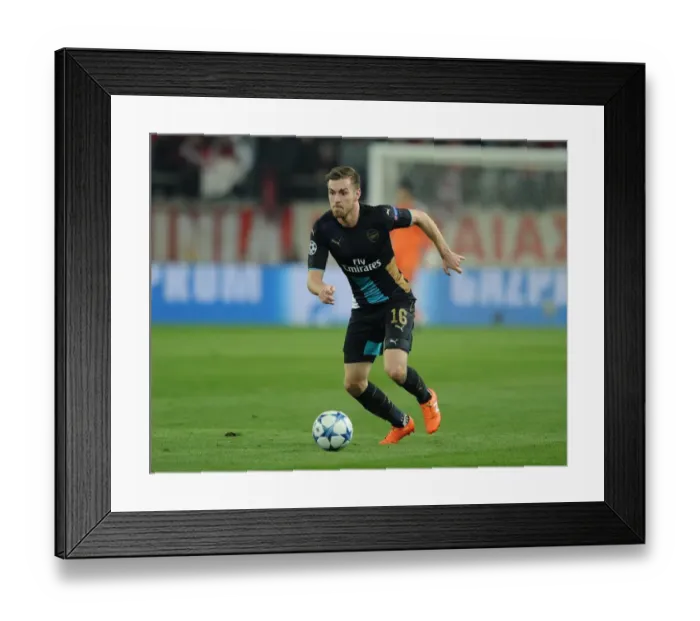 Framed Print : Arsenal's Aaron Ramsey in Action against Olympiacos, UEFA Champions League (December 2015)