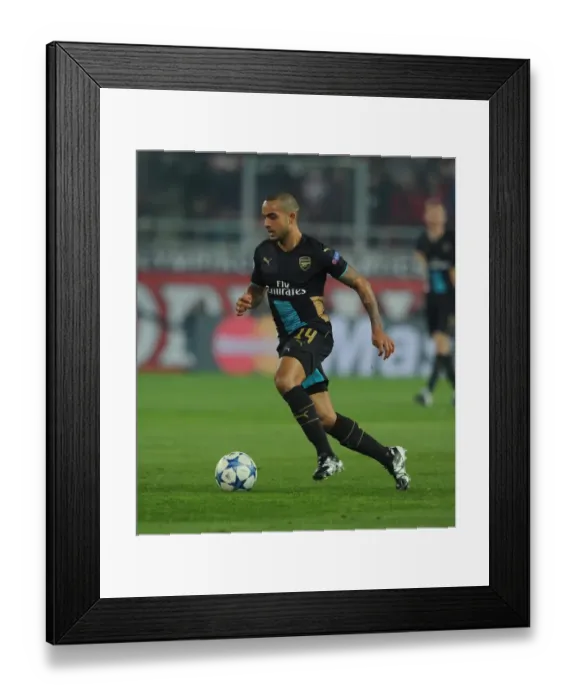 Framed Print : Theo Walcott's Brilliant Performance: Arsenal Crushes Olympiacos 3-0 in Champions League