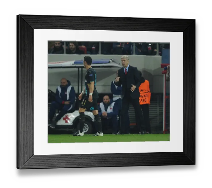 Framed Print : Arsene Wenger and Mesut Ozil: A Strategic Discussion Amidst the Champions League Battle (Olympiacos vs. Arsenal, 2015) Framed Print : Arsene Wenger and Mesut Ozil: A Strategic Discussion Amidst the Champions League Battle (Olympiacos vs. Arsenal, 2015)