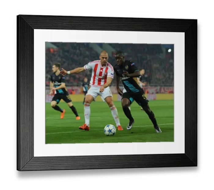 Framed Print : Clash in Athens: Campbell vs. Kasami - Olympiacos vs. Arsenal, UEFA Champions League Framed Print : Clash in Athens: Campbell vs. Kasami - Olympiacos vs. Arsenal, UEFA Champions League