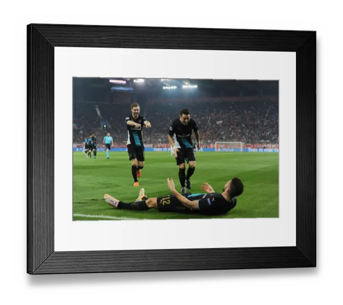 Framed Print : Arsenal Triumph: Giroud, Ozil, Ramsey Celebrate Goals Against Olympiacos in UEFA Champions League (December 2015)