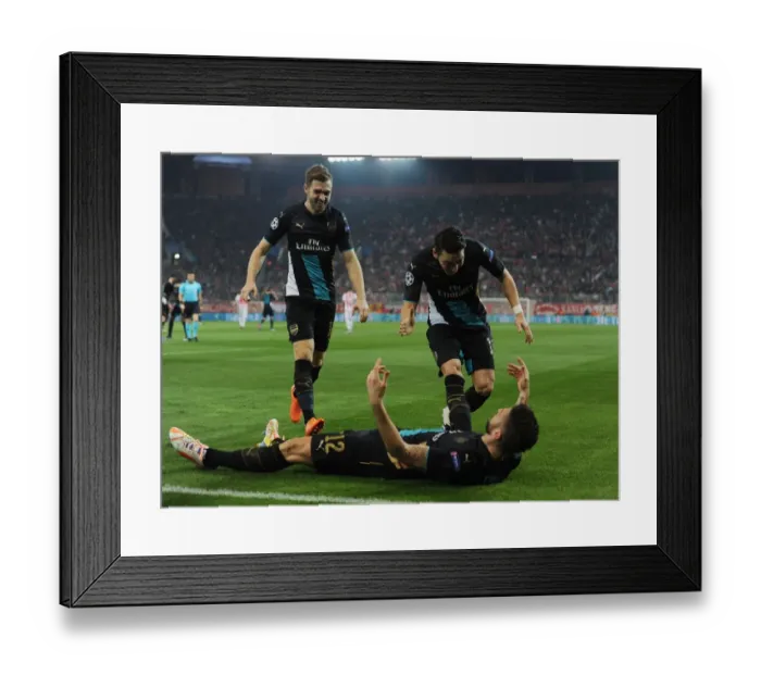 Framed Print : Arsenal Triumph: Giroud, Ramsey, Ozil Celebrate Goals Against Olympiacos in Champions League Framed Print : Arsenal Triumph: Giroud, Ramsey, Ozil Celebrate Goals Against Olympiacos in Champions League
