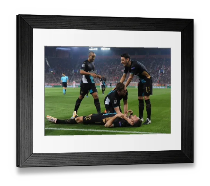 Framed Print : Arsenal's Star Players: Giroud, Ramsey, Ozil, and Walcott Celebrate Double Strike Against Olympiacos in the UEFA Champions League
