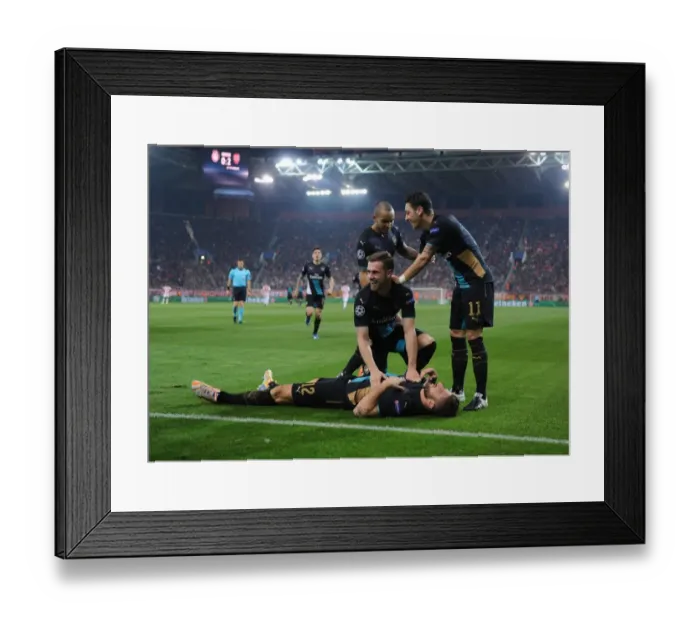 Framed Print : Arsenal's Stars: Giroud, Ramsey, Ozil, and Walcott Celebrate Goals Against Olympiacos in the UEFA Champions League