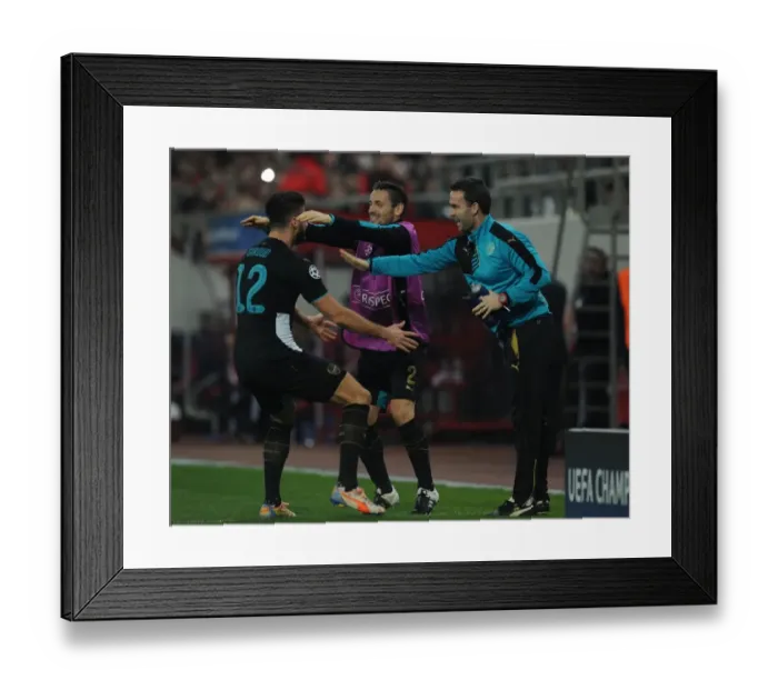 Framed Print : Arsenal Triumph: Giroud, Debuchy, and Forsythe Celebrate Goals Against Olympiacos in the UEFA Champions League Framed Print : Arsenal Triumph: Giroud, Debuchy, and Forsythe Celebrate Goals Against Olympiacos in the UEFA Champions League