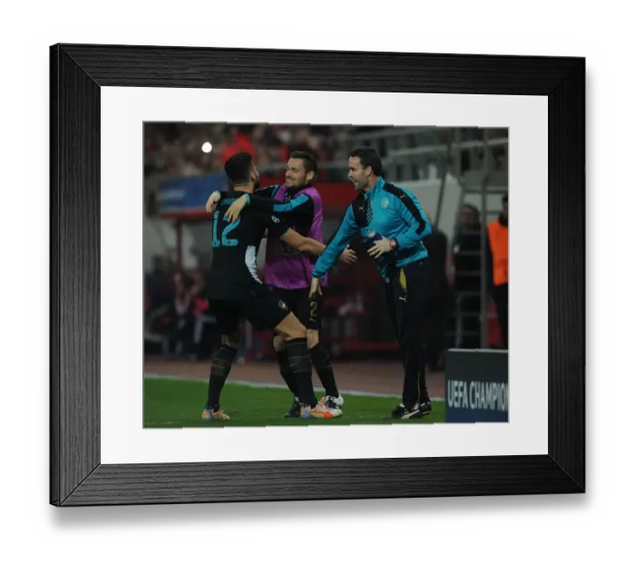 Framed Print : Arsenal's Triumph: Giroud, Debuchy, and Forsythe Celebrate Goals Against Olympiacos in the UEFA Champions League Framed Print : Arsenal's Triumph: Giroud, Debuchy, and Forsythe Celebrate Goals Against Olympiacos in the UEFA Champions League