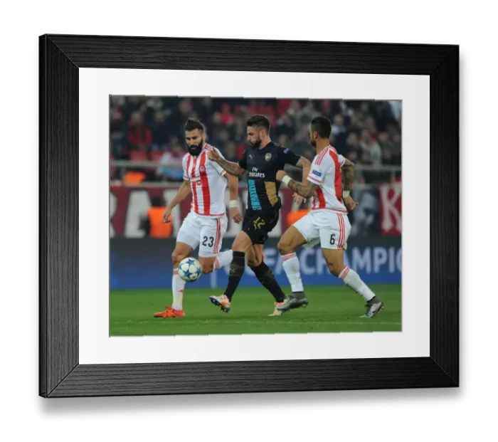 Framed Print : Giroud's Intense Battle with Siovas and da Costa: Olympiacos vs. Arsenal UEFA Champions League Clash Framed Print : Giroud's Intense Battle with Siovas and da Costa: Olympiacos vs. Arsenal UEFA Champions League Clash