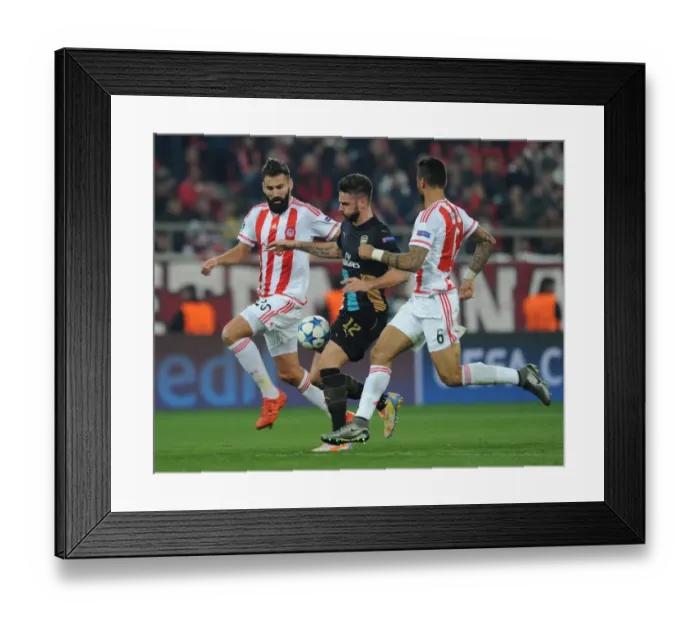 Framed Print : Giroud Goes Head-to-Head with Siovas and da Costa in Olympiacos vs Arsenal UEFA Champions League Clash Framed Print : Giroud Goes Head-to-Head with Siovas and da Costa in Olympiacos vs Arsenal UEFA Champions League Clash