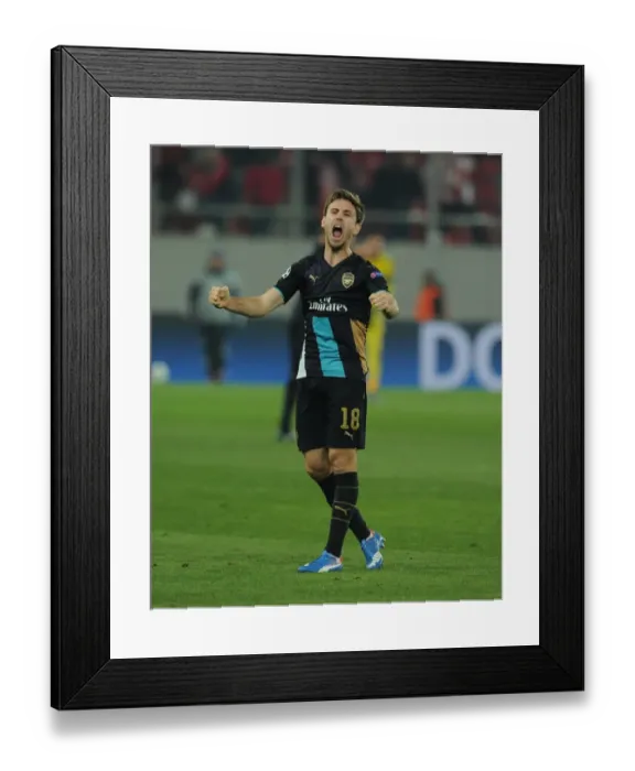 Framed Print : Nacho Monreal Celebrates Arsenal's UEFA Champions League Victory over Olympiacos