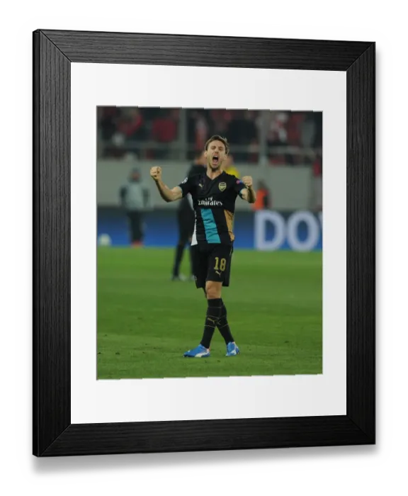 Framed Print : Nacho Monreal's Exuberant Celebration: Arsenal's UEFA Champions League Victory over Olympiacos