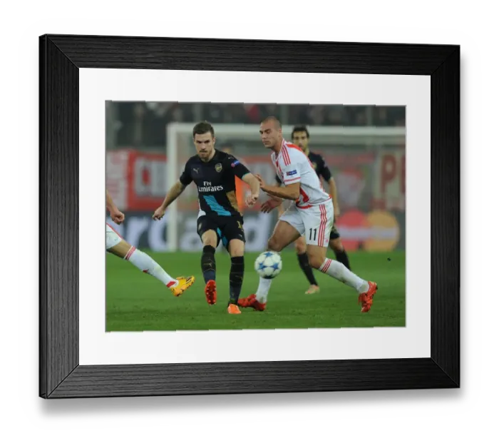 Framed Print : Clash of Champions: Ramsey vs. Kasami - Arsenal vs. Olympiacos Framed Print : Clash of Champions: Ramsey vs. Kasami - Arsenal vs. Olympiacos