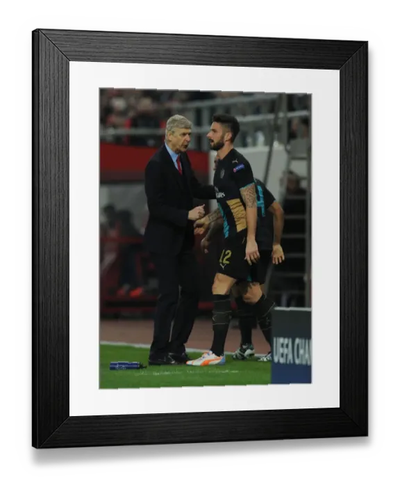 Framed Print : Arsene Wenger and Olivier Giroud: Celebrating Arsenal's Goal Against Olympiacos in the UEFA Champions League