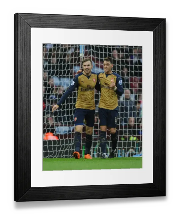 Framed Print : Arsenal's Ramsey and Ozil: Celebrating a Goal-Scoring Duo in Aston Villa vs Arsenal (2015-16) Framed Print : Arsenal's Ramsey and Ozil: Celebrating a Goal-Scoring Duo in Aston Villa vs Arsenal (2015-16)