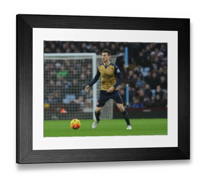 Framed Print : Laurent Koscielny's Intense Concentration During Aston Villa vs Arsenal Premier League Match Framed Print : Laurent Koscielny's Intense Concentration During Aston Villa vs Arsenal Premier League Match