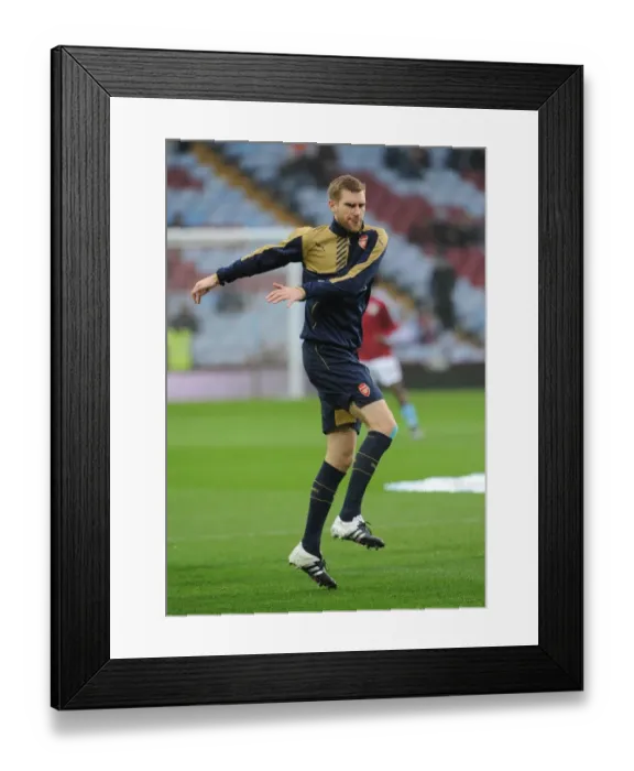 Framed Print : Per Mertesacker Gears Up: Aston Villa vs Arsenal (2015-16 Premier League)