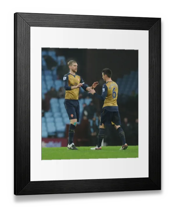 Framed Print : Arsenal's Per Mertesacker and Laurent Koscielny Share a Heartfelt Moment After Aston Villa Match, 2015-16 Premier League