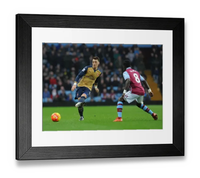 Framed Print : Mesut Ozil Faces Pressure from Idrissa Gana: A Battle in the Premier League (Aston Villa vs Arsenal, 2015-16)