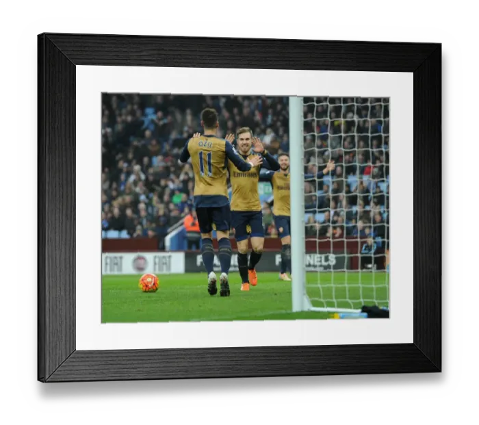 Framed Print : Ramsey and Ozil's Unforgettable Goal Celebration: Arsenal's Victory Against Aston Villa (2015-16)