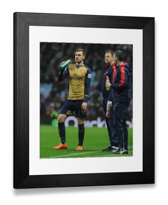 Framed Print : Aaron Ramsey's Heart-to-Heart with Arsenal Physio Colin Lewin (2015-16)