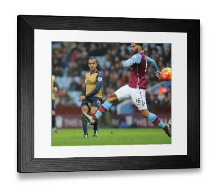 Framed Print : Theo Walcott vs Joleon Lescott: A Premier League Showdown