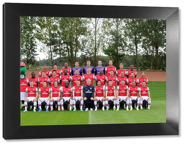 ST ALBANS, ENGLAND - SEPTEMBER 20: Arsenal Squad 2013  /  14 with Gunnersaurus at London