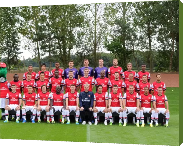 ST ALBANS, ENGLAND - SEPTEMBER 20: Arsenal Squad 2013  /  14 with Gunnersaurus at London