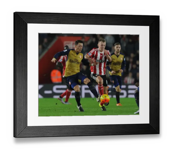 Framed Print : Mesut Ozil's Masterful Performance: Outsmarting James Ward-Prowse at Southampton, Premier League 2015-16
