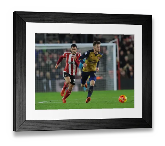 Framed Print : Ramsey vs Juanmi: A Battle of Will at Southampton's St Marys Stadium - Arsenal vs Southampton, Premier League 2015-16