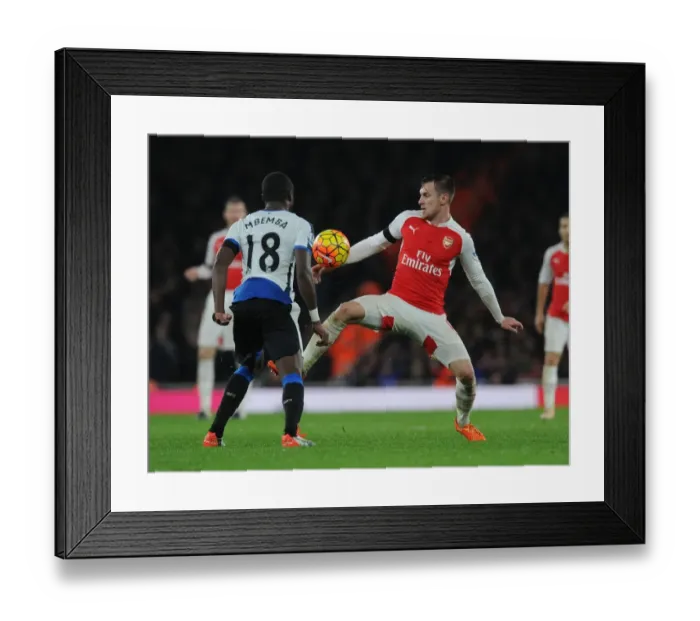 Framed Print : Arsenal vs Newcastle United: Ramsey vs Mbemba's Intense Battle in the Premier League