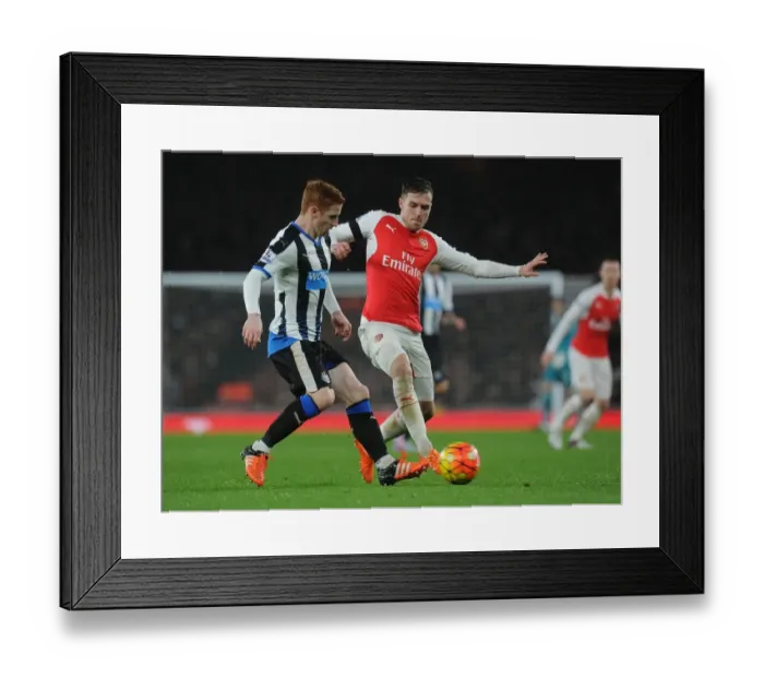 Framed Print : Ramsey vs. Colback: A Footballing Battle at Emirates Stadium Framed Print : Ramsey vs. Colback: A Footballing Battle at Emirates Stadium
